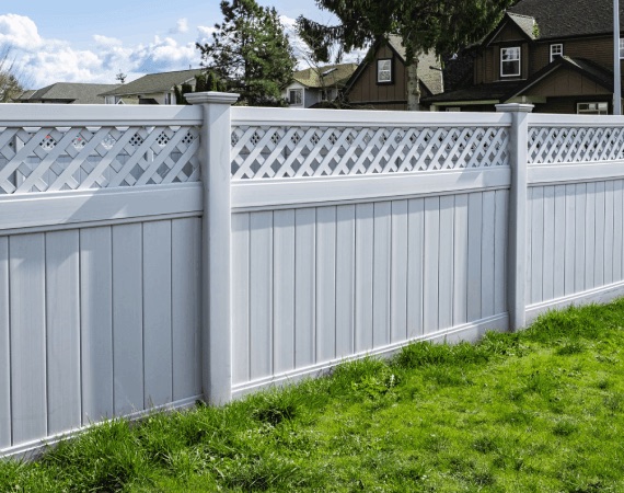 Freshly painted white fence with lattice top